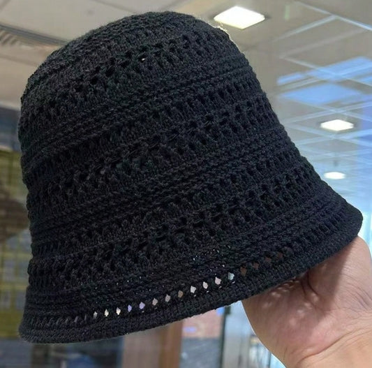 One Black woven straw bucket hat for women