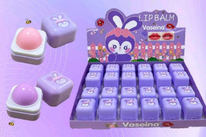 Vaseina lip balm display with cartoon character on a purple background
