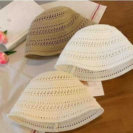 One Black woven straw bucket hat for women